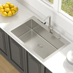 Lordear Stainless steel kitchen sink with faucet on a countertop with lemons.